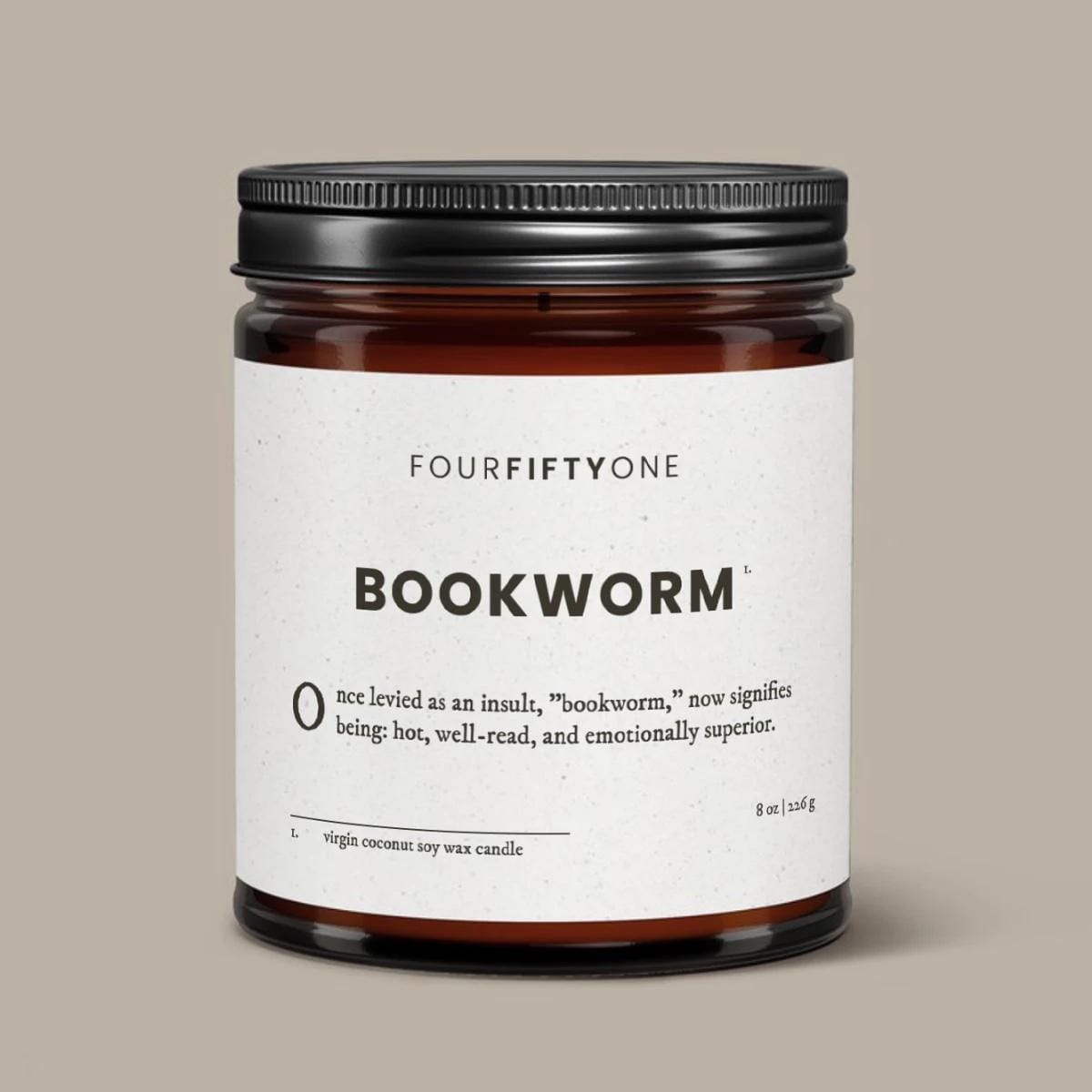 Bookworm soy candle in an amber glass jar with a black lid, cream label with FOURFIFTYONE branding.