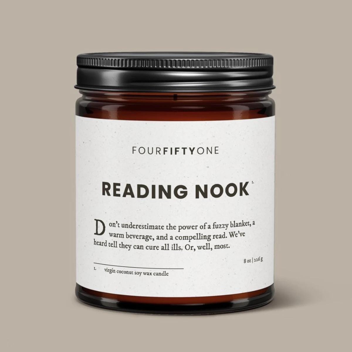 Reading Nook soy candle in an amber glass jar with a black lid, cream label with FOURFIFTYONE branding.